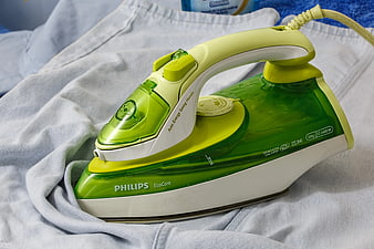Green Philips EcoCare Iron on White Fabric