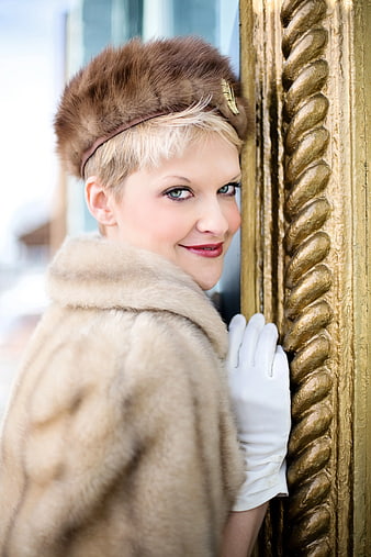 Elegant Woman in Vintage Fur Coat and Hat