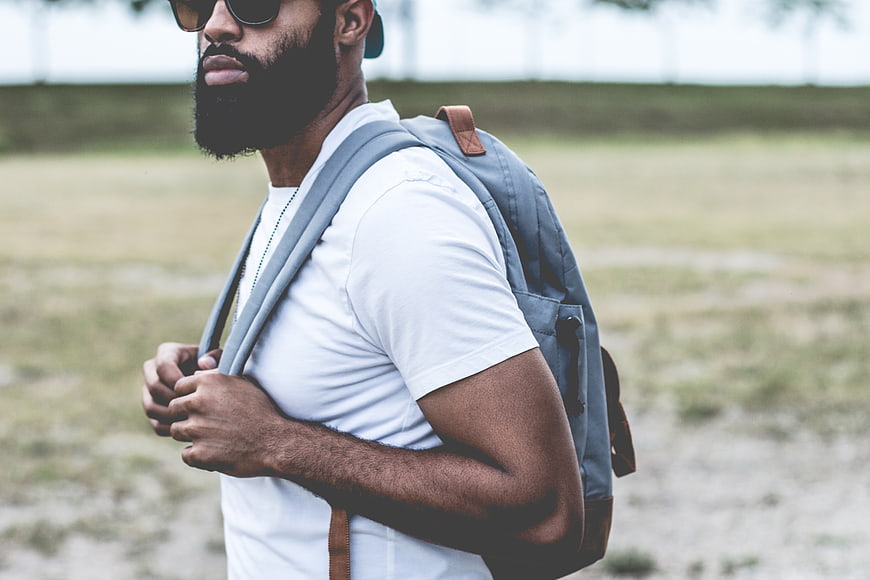 Stylish Bearded Man with Backpack and Sunglasses