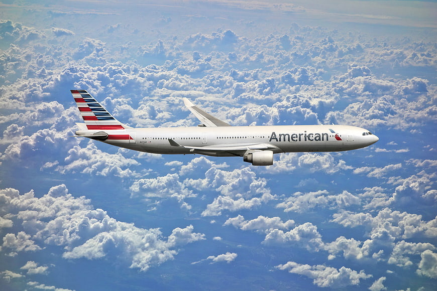 American Airlines Jet Flying Above Clouds