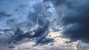 Dramatic Dark Storm Clouds With Bright Sky Breaks