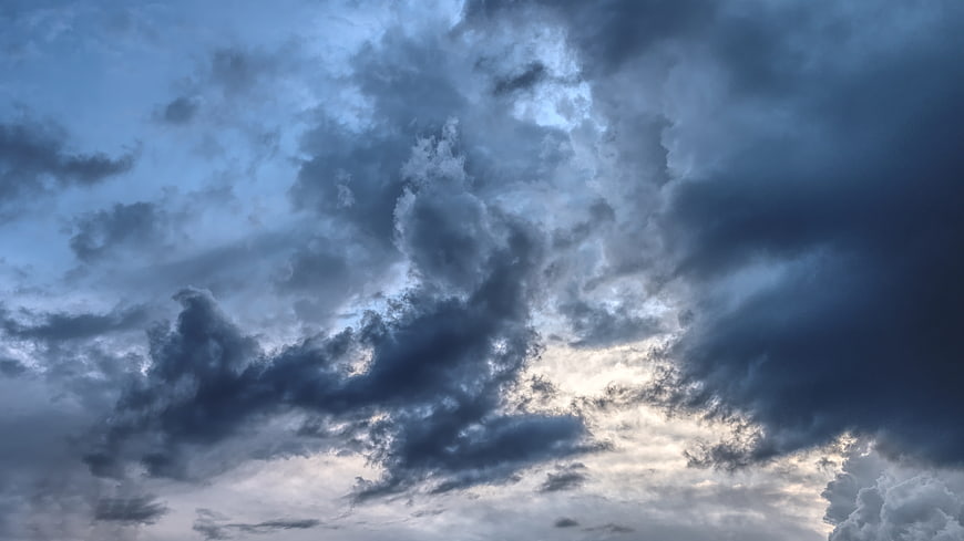 Dramatic Dark Storm Clouds With Bright Sky Breaks