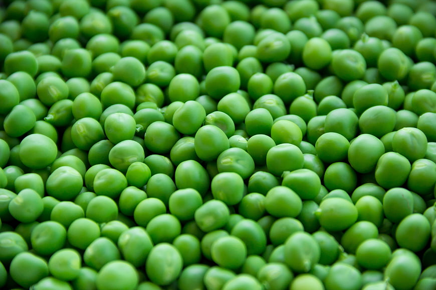 Close-up of fresh green peas filling the frame
