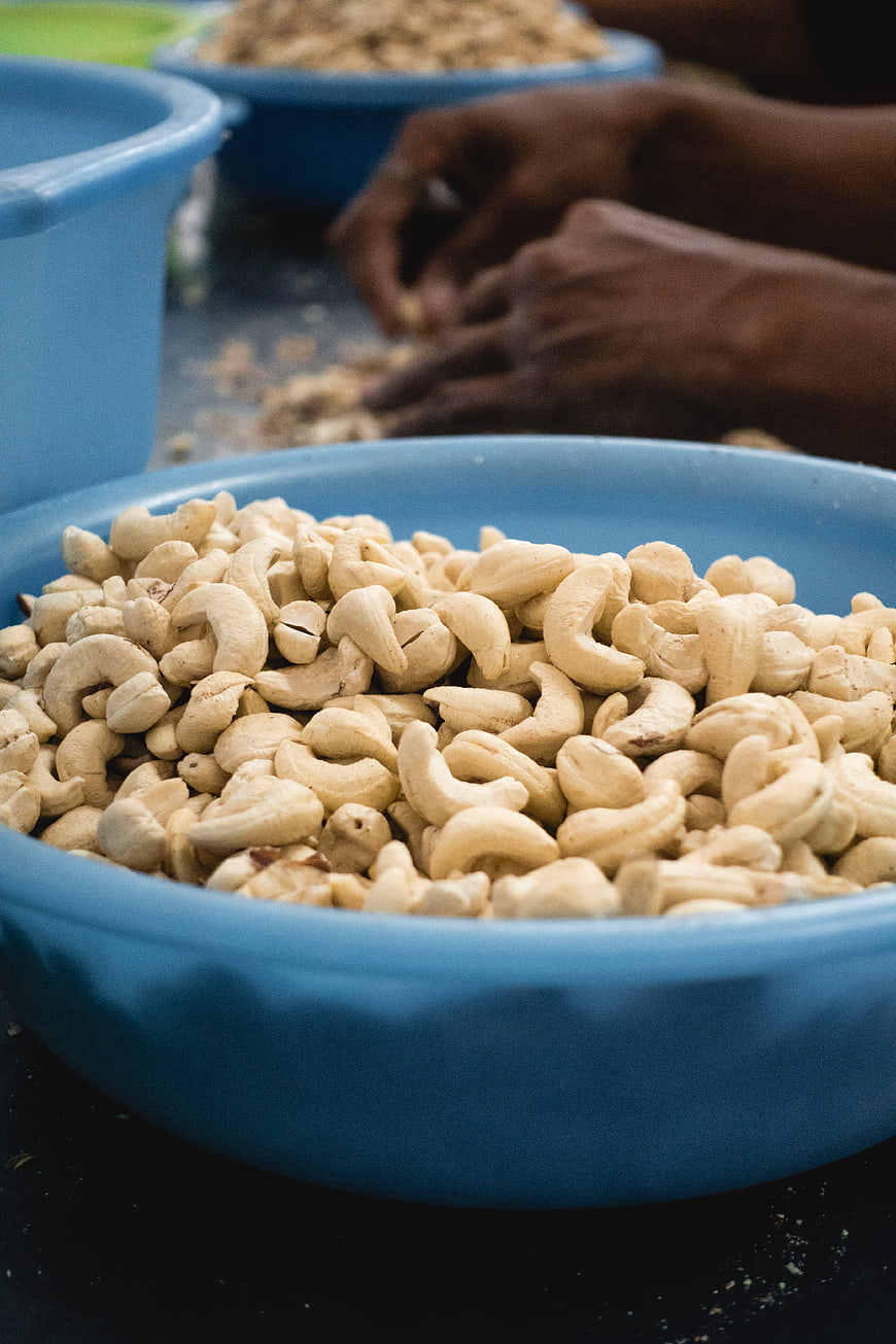 Close-up of raw cashew nuts in a blue bowl