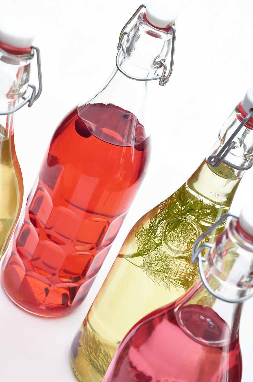 Colorful Herbal Infused Spirits in Glass Bottles