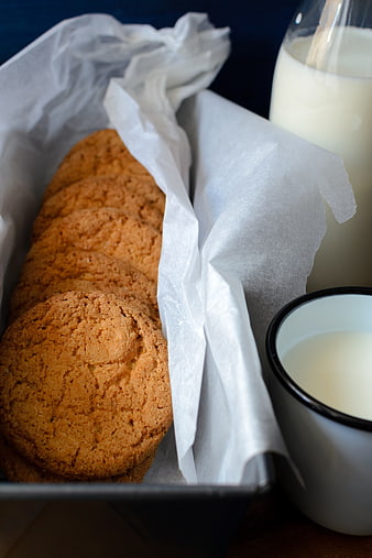 Homemade cookies in tin with milk