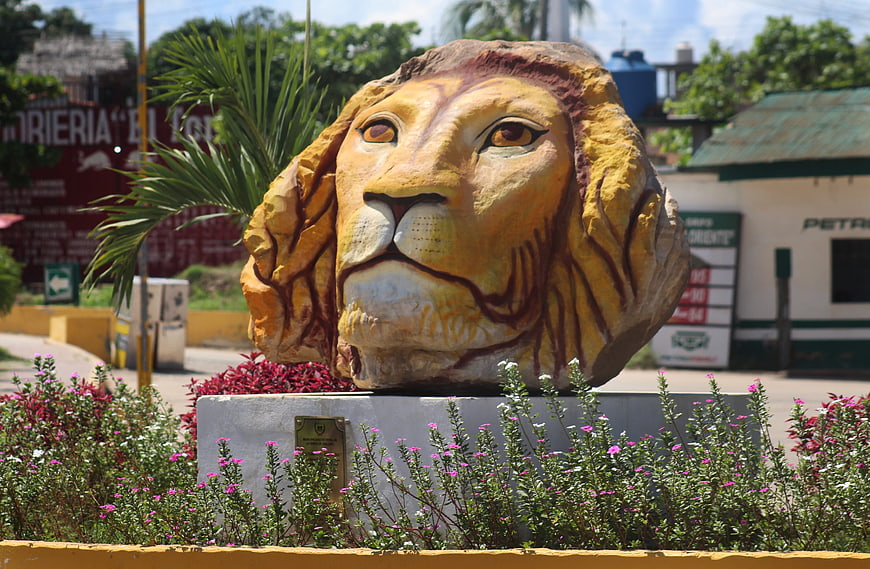 Colorful Lion Head Sculpture in Tropical Garden