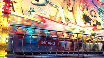 Motion blur carnival ride with entrance sign