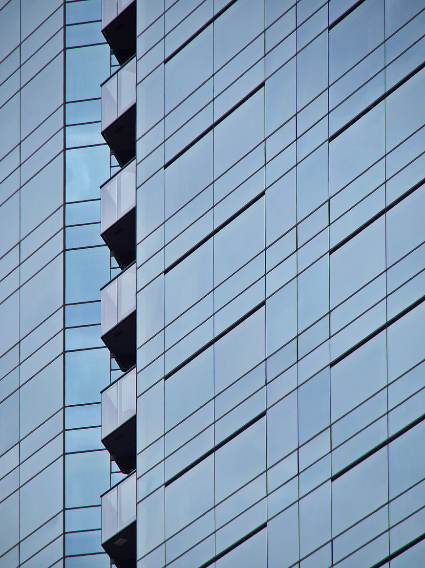 Modern Glass Office Building Facade with Geometric Pattern