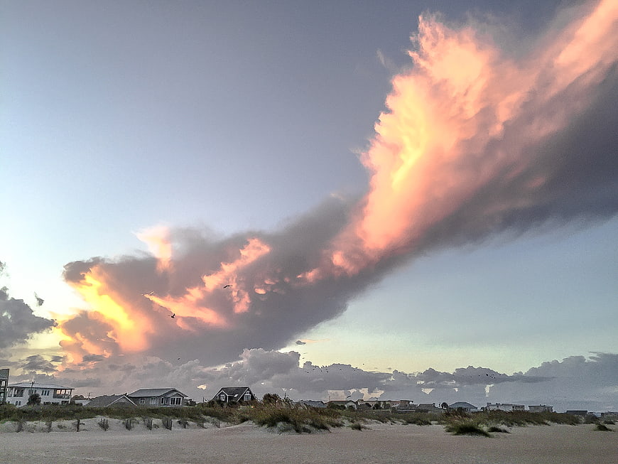 Dramatic Sunset Clouds Over Coastal Beach Houses