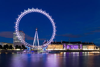 London Eye Ferris Wheel Illuminated at Night on River Thames