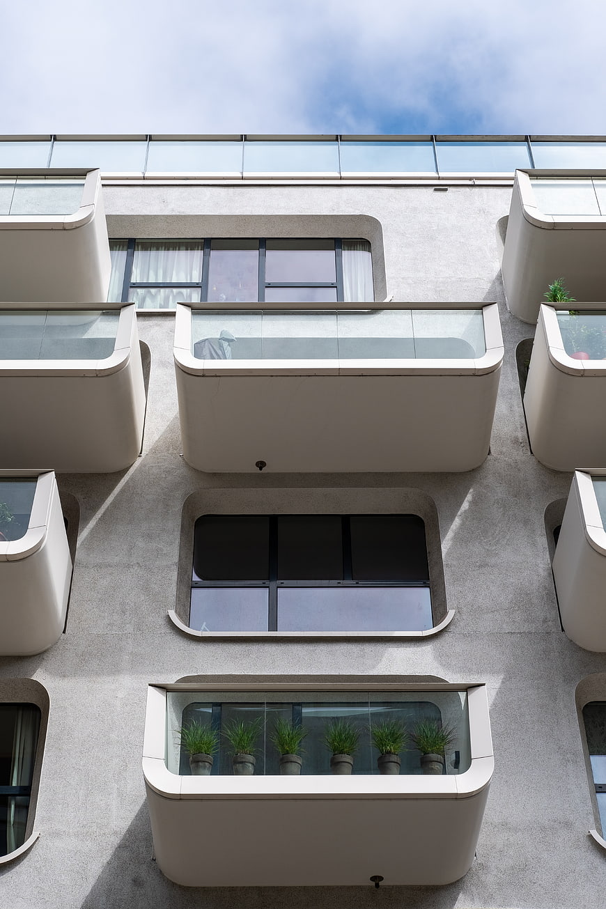 Modern Apartment Building Facade with Geometric Balconies