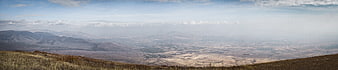 Panoramic view of vast valley and distant mountains
