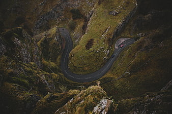 Aerial View of Winding Mountain Road with Cars
