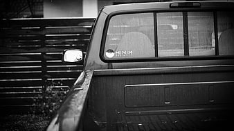 Black and white pickup truck with design sticker