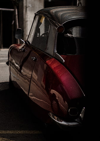 Vintage Red Car Side Profile in Dark Moody Lighting