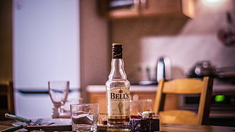 Bell's Scotch Whisky Bottle on Wooden Dining Table