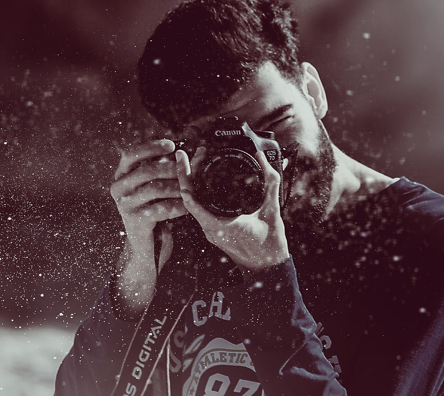 Male Photographer Taking Photo with DSLR Camera