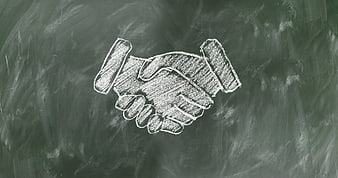 Chalk drawing of handshake on blackboard background