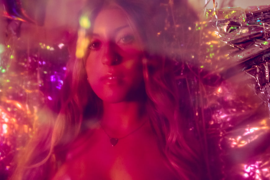 Woman in Neon Club Atmosphere with Disco Lights