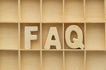 Wooden FAQ letters in a grid box