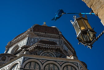 Florence Cathedral Dome and Street Lamp Against Blue Sky