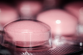 Close-up of pink pills in blister pack