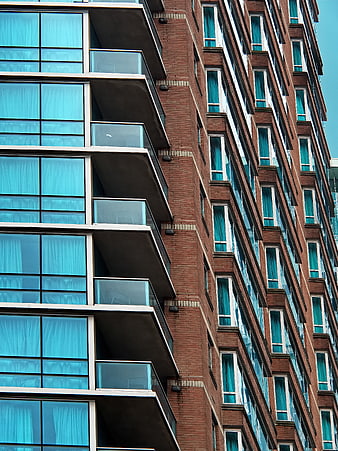 Modern Apartment Building Facade with Blue Glass Windows