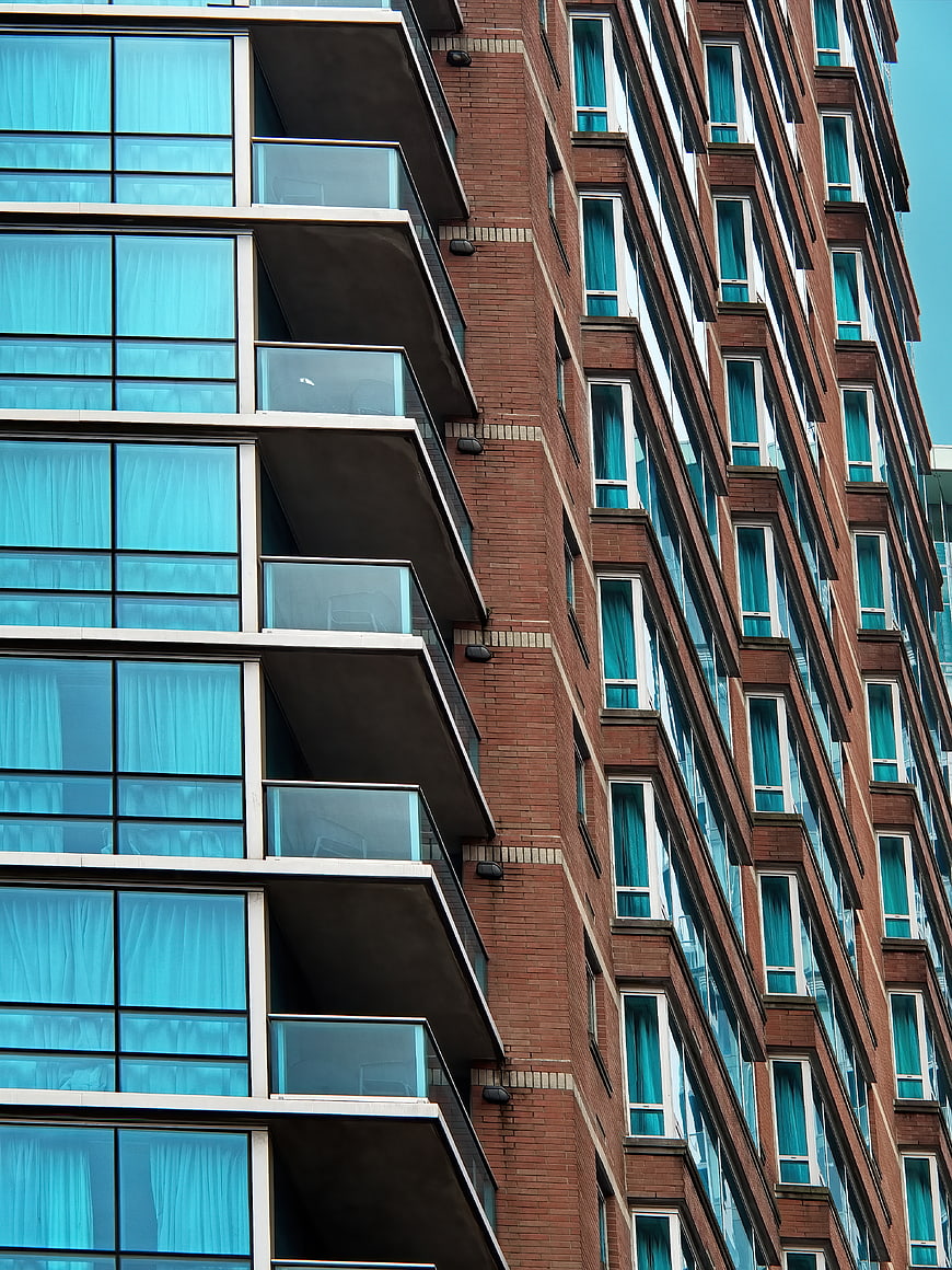 Modern Apartment Building Facade with Blue Glass Windows