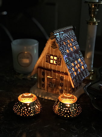 Glowing ceramic house candle holder with tea lights