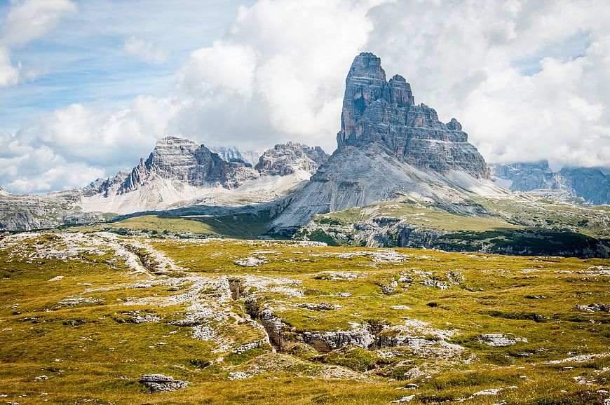 Dramatic Dolomites Mountain Landscape with Green Alpine Meadow