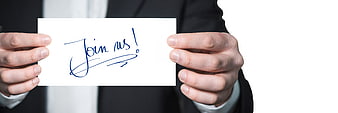 Businessman holding card with handwritten join us invitation