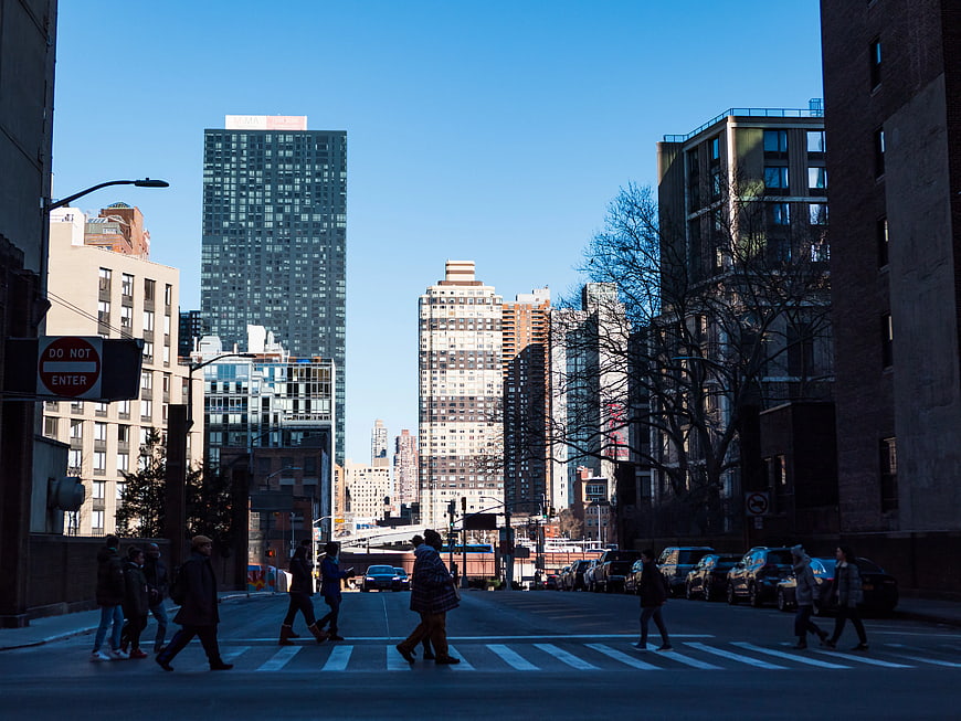 Pedestrians Crossing Street in Urban Cityscape