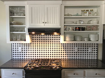Modern kitchen with black and white octagon tile backsplash