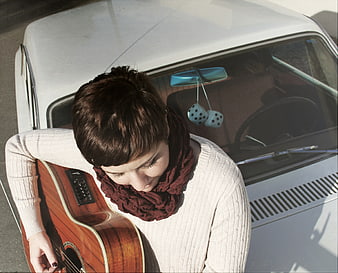 High Angle View of Woman with Guitar by Vintage Car