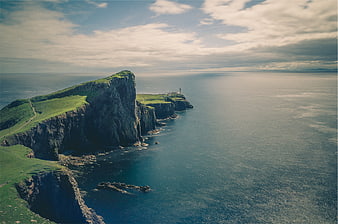Aerial View of Dramatic Coastal Cliffs and Lighthouse
