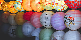 Colorful Asian Paper Lanterns Hanging in Dark Setting