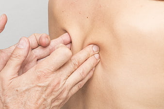 Close-up of hands performing manual therapy massage on back