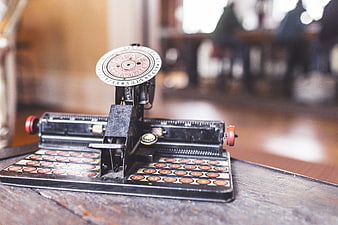 Vintage Dial Typewriter on Wooden Table
