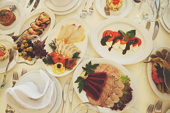 Elegant Dinner Table Setting With Assorted Appetizers And Cold Cuts