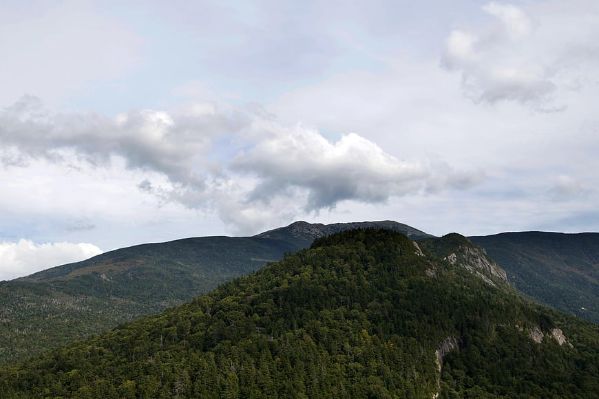 Aerial View of Green Mountain Ridge Under Cloudy Sky