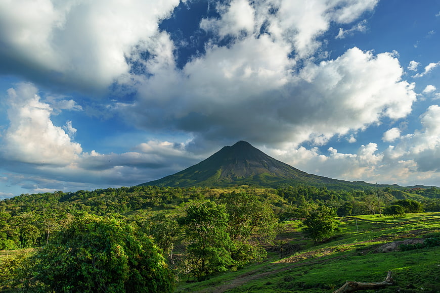 Arenal Volcano Landscape with Dramatic Clouds and Green Hills