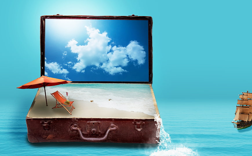 Vintage suitcase with beach scene inside and sailing ship