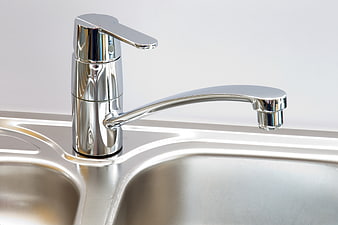 Modern Chrome Kitchen Faucet On Stainless Steel Sink