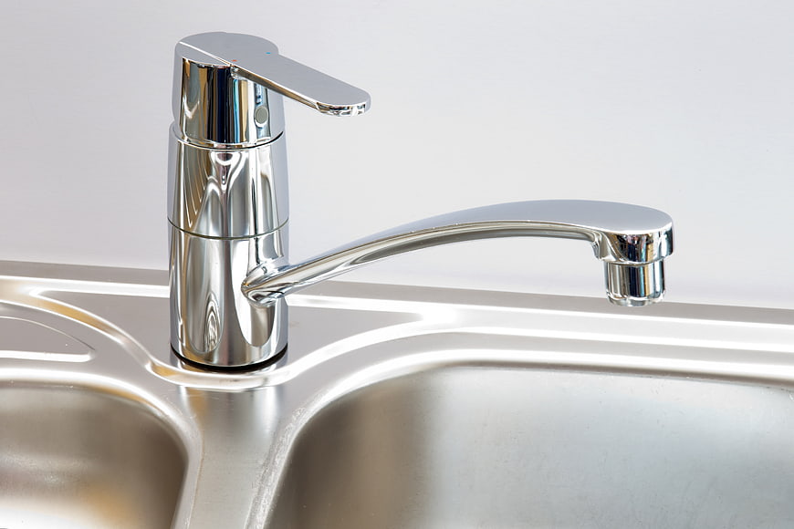 Modern Chrome Kitchen Faucet On Stainless Steel Sink
