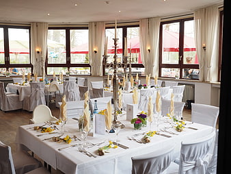 Elegant Wedding Reception Hall with White Table Settings
