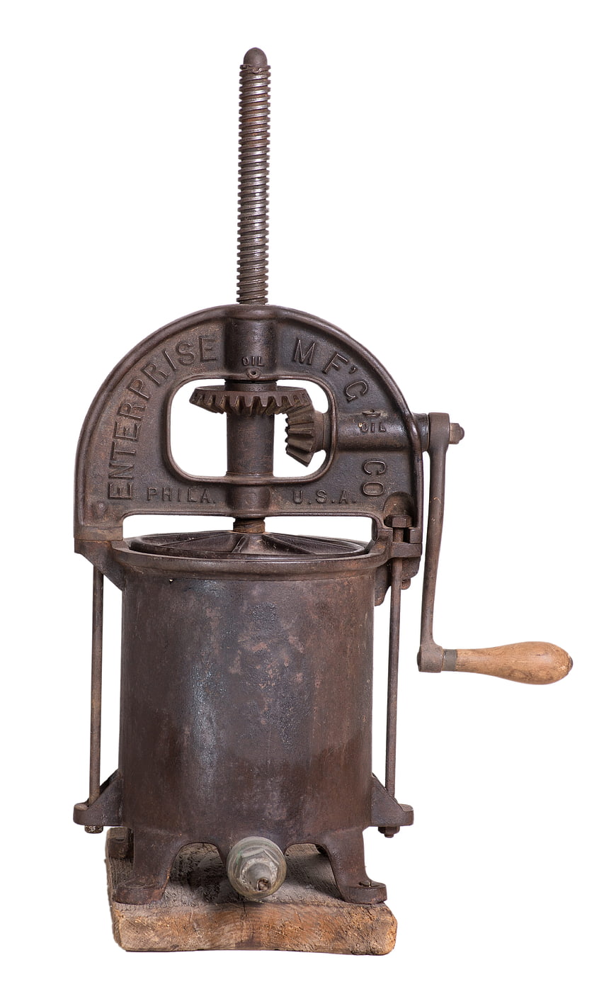 Antique Cast Iron Oil Press on White Background