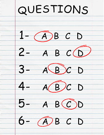 Handwritten multiple choice test answers on lined notebook paper