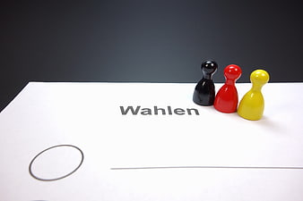 German ballot paper with black, red, and gold chess pieces