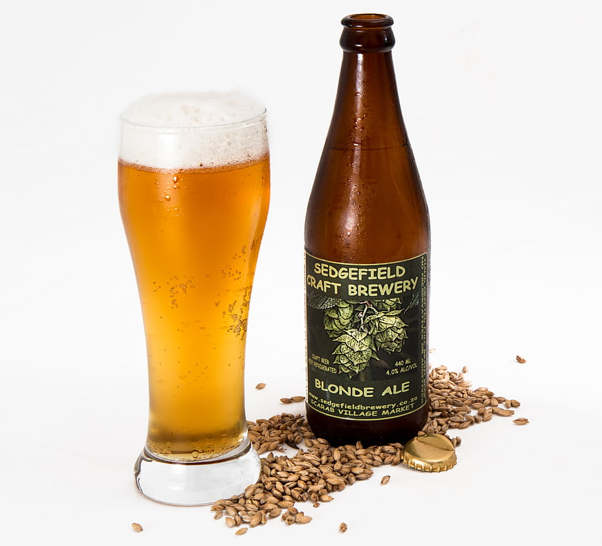 Craft Blonde Ale Bottle and Glass with Barley Grains